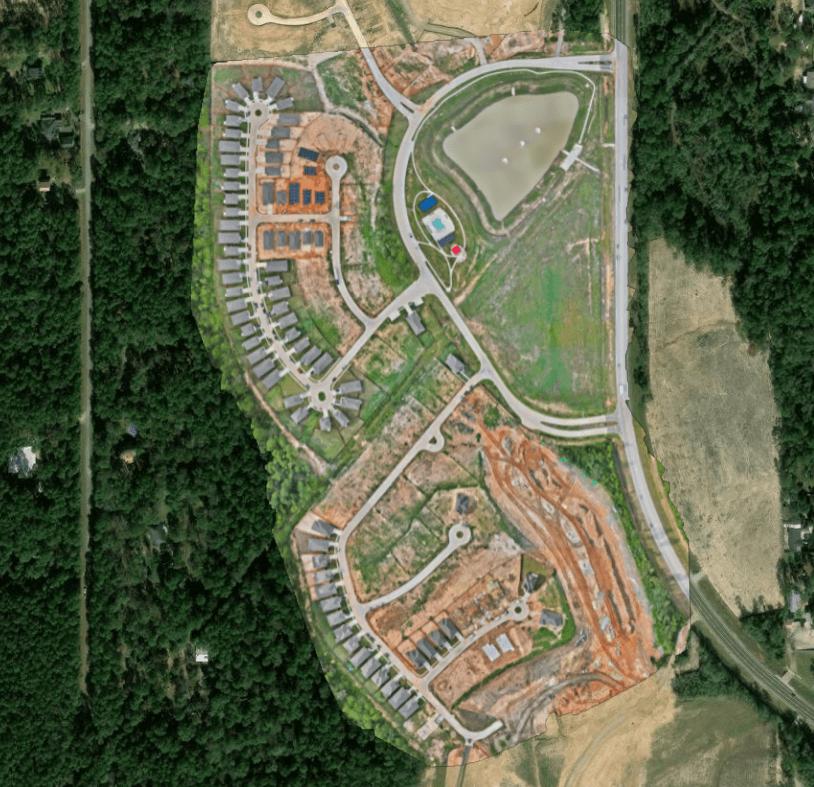 Aerial orthomosaic of a residential land development over a satellite basemap in the SpearAtlas Orthomosaic Room